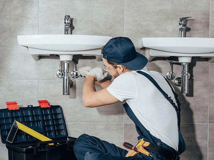 Experienced plumber fixing a kitchen sink in Little Falls NJ