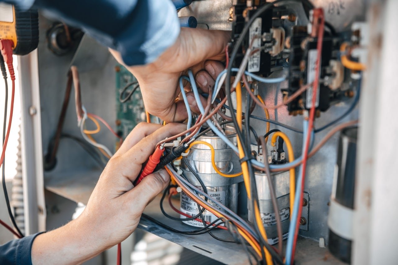 Professional HVAC expert repairing a furnace system in Lincoln Park